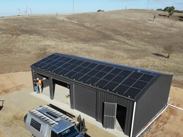 21 solar panels on shed roof for off-grid power system